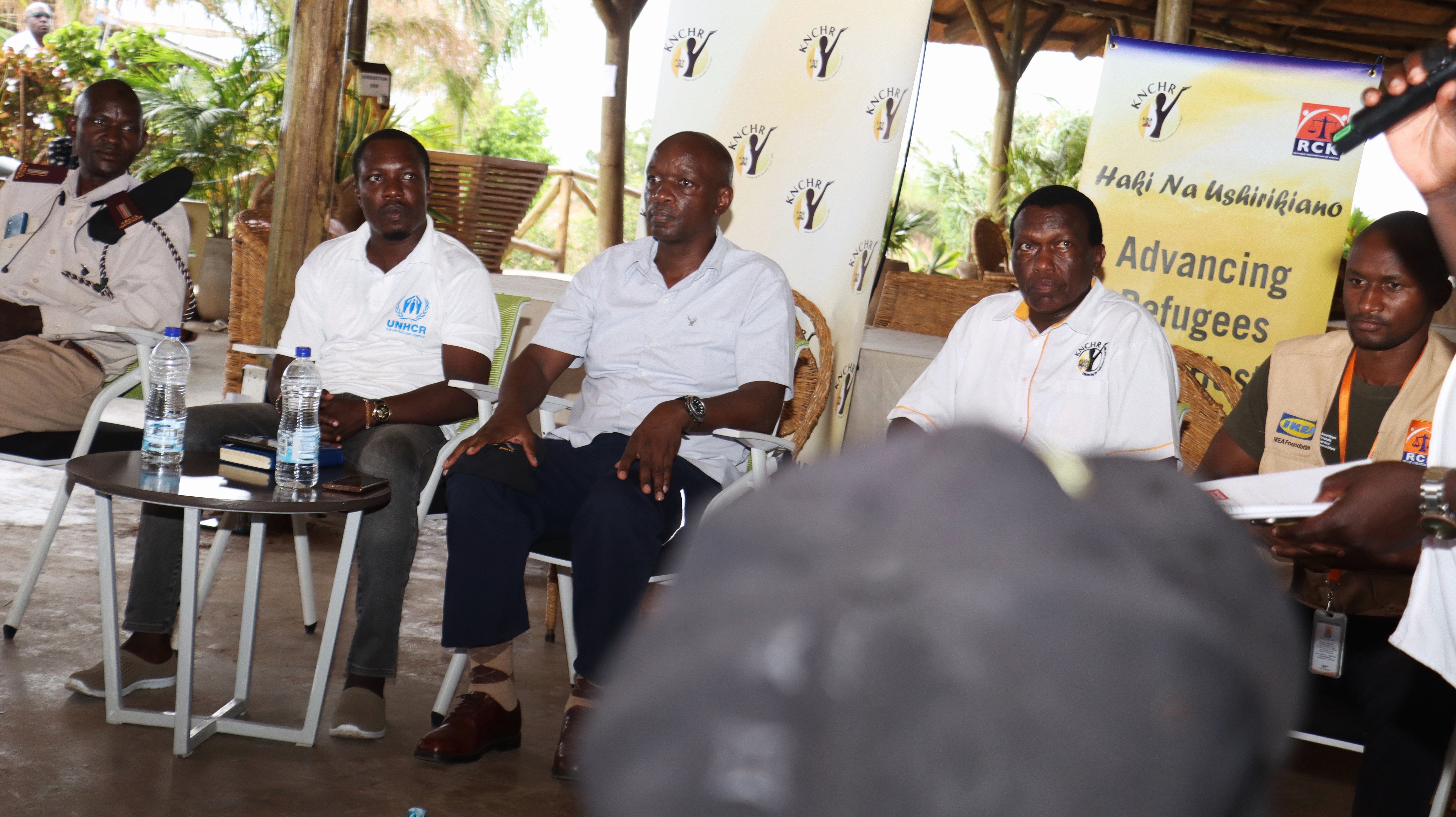 Panelists at a townhall in Kakuma, organized by the Haki na Ushirikiano Project through KNCHR and RCK
